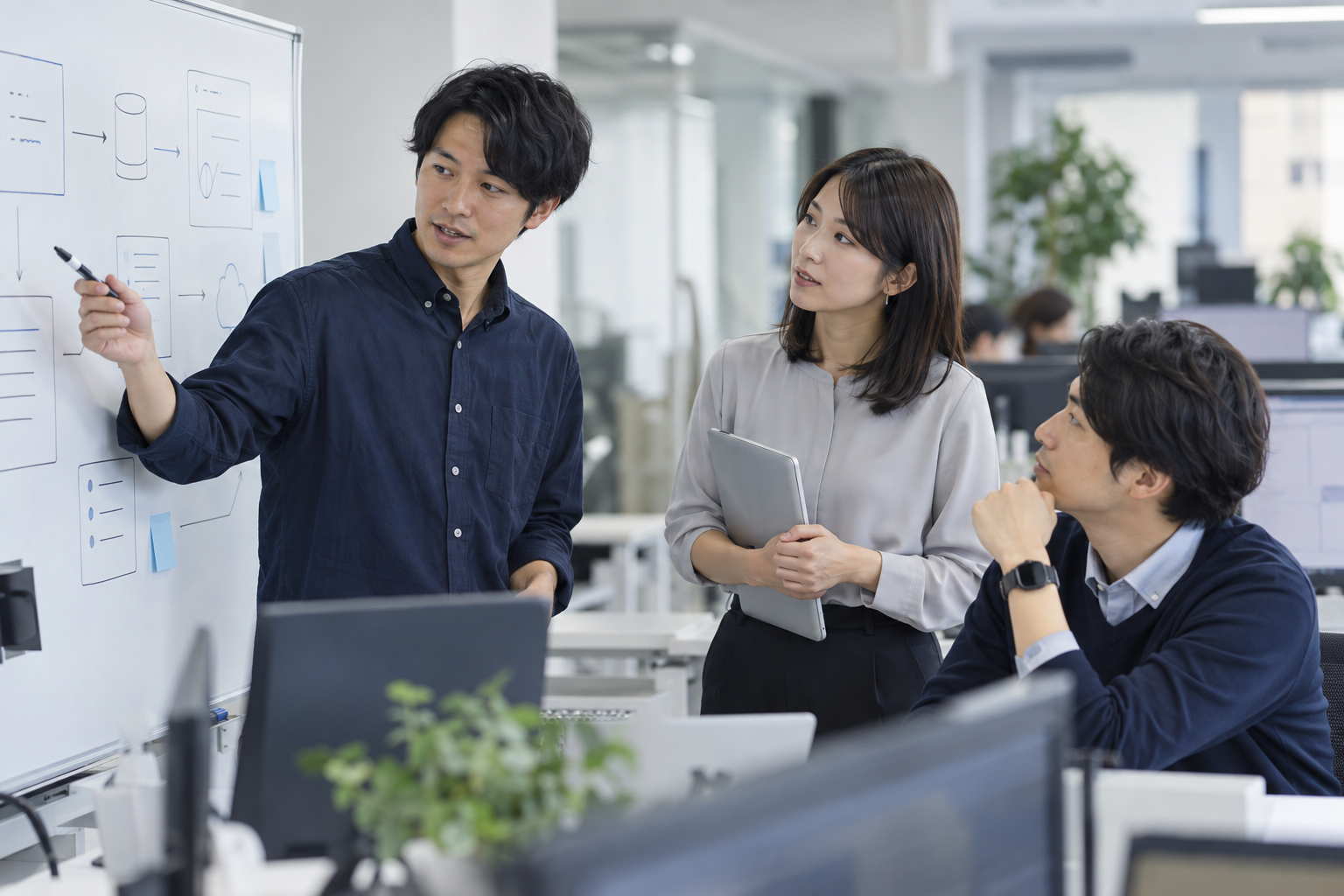 仕事風景のイメージ（AI生成・架空の人物と職場）